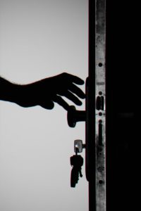 Outsource physical security? picture of silhouette photo of person holding door knob